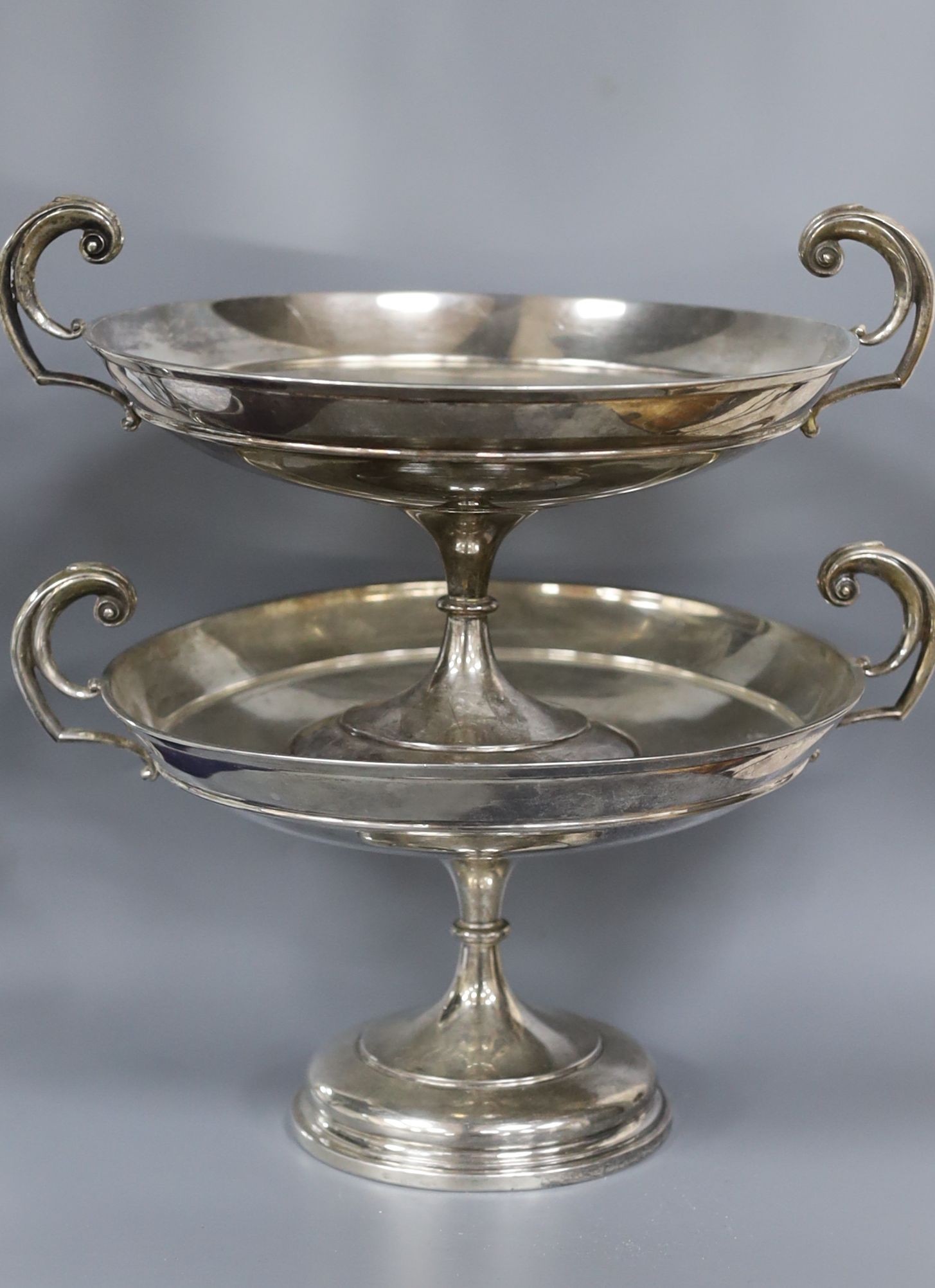 A pair of George V silver tazze, with flying scroll handles, Walker & Hall, Sheffield, 1912, height 16cm. 30oz.